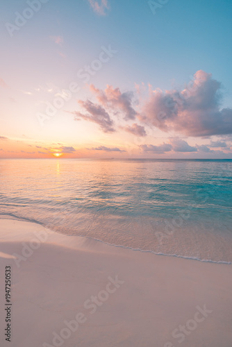 Breathtaking tropical beach at sunset with radiant golden sky, tranquil ocean waves and pristine island shore, dreamy summer vacation travel background