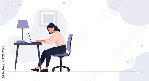 Woman working on laptop at desk in modern home office, minimalist design