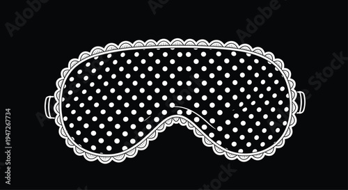 Black and white sleep mask with a polka dot pattern and a ruffled lace border, presented against a solid black background.