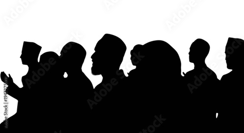 Silhouettes of diverse individuals gathered closely together in a group