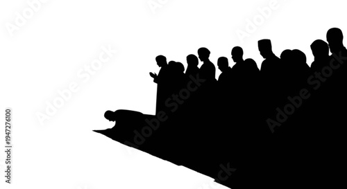 Silhouette of a speaker addressing a large attentive audience