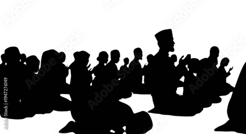 Silhouette of a group of people gathered around a central figure in a seated position