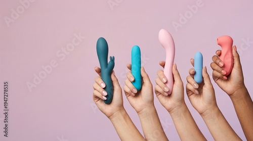 Hands holding various colorful vibrators on purple background