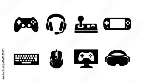 Collection of gaming icons including controller, headset, joystick, and VR headset. A set of black icons representing various gaming devices and accessories on a white background
