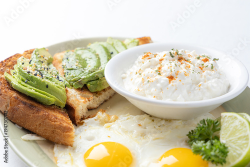 Avocado toast with fried eggs and cottage cheese