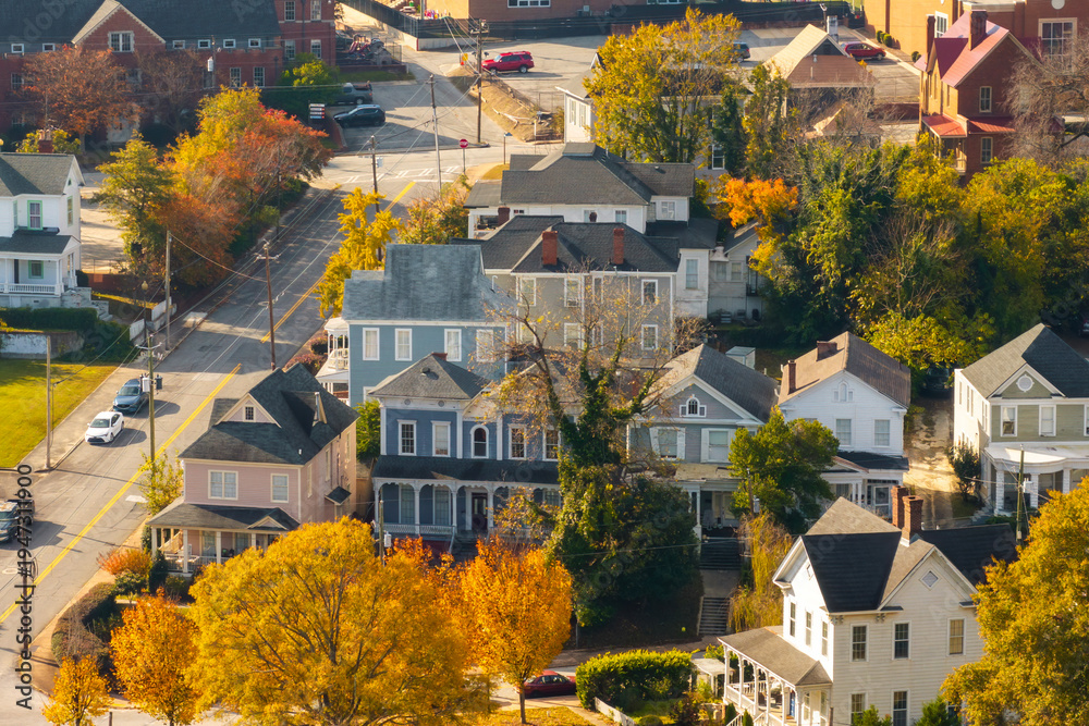Naklejka premium Old historic city architecture in Southern USA. View from above of Victorian mansions and streets of Macon, Georgia in colorful fall season.