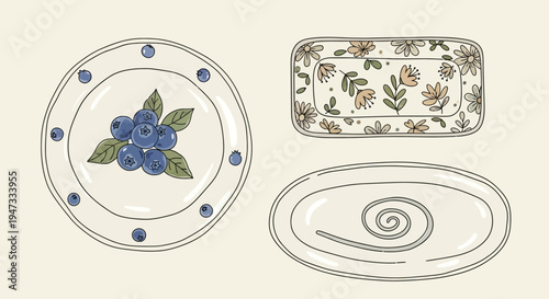 Set of three decorative ceramic plates with floral and abstract designs.