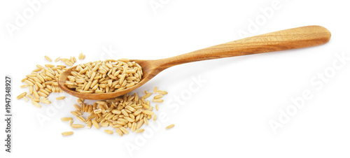 Oat grain in spoon isolated on white