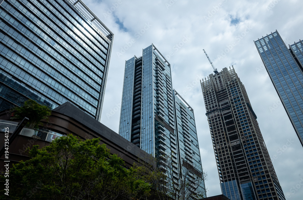 Fototapeta premium Modern skyscrapers under overcast sky