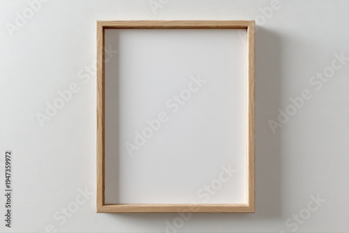 Minimalist Wooden Frame Mockup on White Wall for Art, Photos, or Graphic Design Presentation