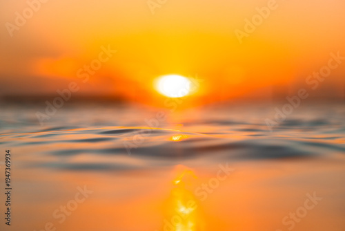 Scenic view of sunrise on the ocean in the summer.