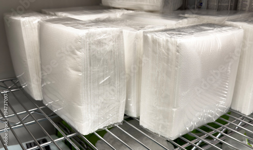 Close up of packaged medical gauze dressings on hospital storage rack