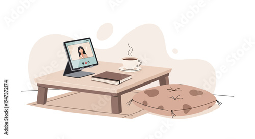 Cozy home office setup with laptop video call, coffee, and book on floor table