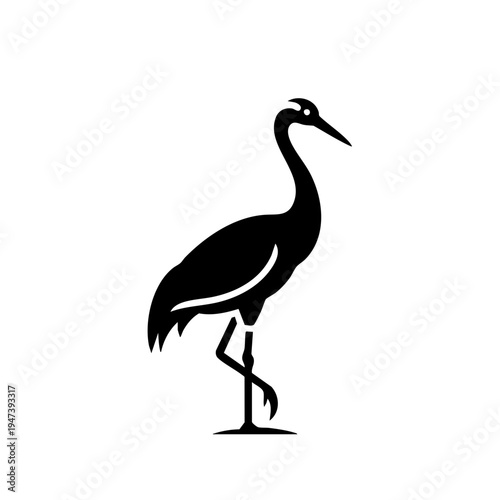 Elegant black silhouette of a wading bird standing on one leg