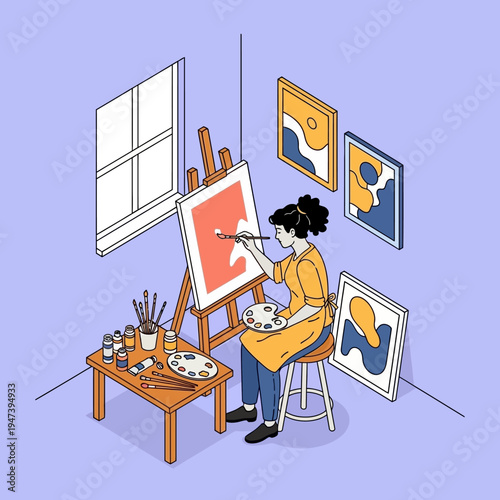 Woman painting artwork in a studio.