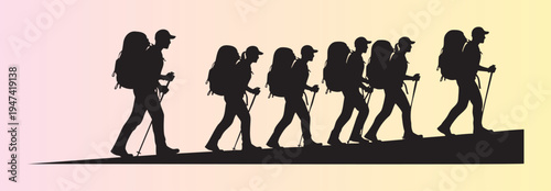 Group of hikers trekking together in silhouette on an adventure journey