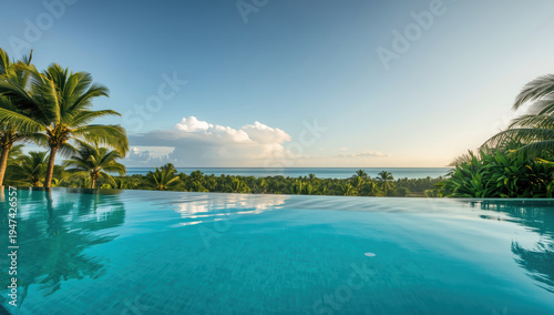 Wallpaper Mural Luxury tropical infinity pool with palm trees overlooking ocean at sunrise calm atmosphere Torontodigital.ca