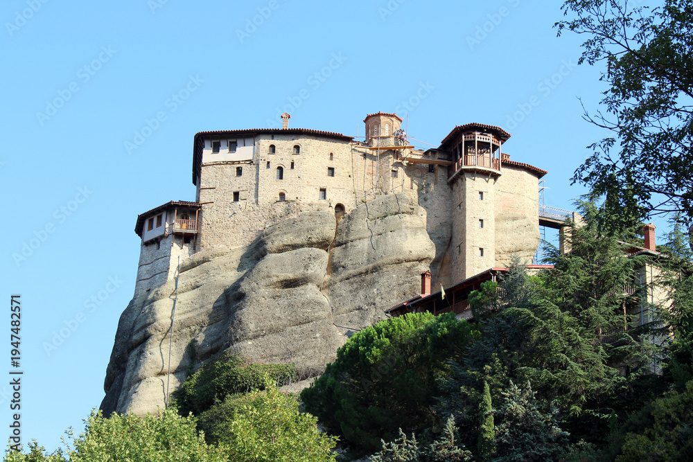 Fototapeta premium Rousanou Monastery Meteora August 2024 Ancient stone convent on steep rock cliff