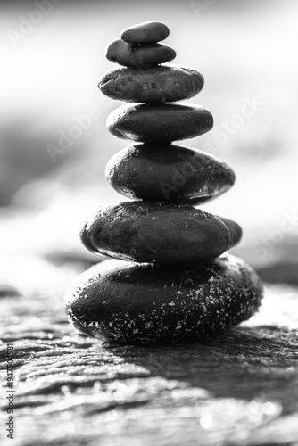 Wallpaper Mural Peaceful nature scene featuring a carefully balanced stack of smooth stones placed on a moss-covered rock.  Torontodigital.ca