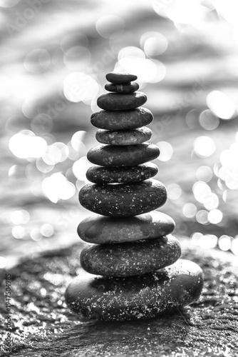 Wallpaper Mural Peaceful nature scene featuring a carefully balanced stack of smooth stones placed on a moss-covered rock.  Torontodigital.ca