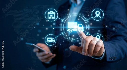 A businessman's hand actively touches a central digital delivery truck icon, while holding a smartphone, illustrating a complex global logistics network.