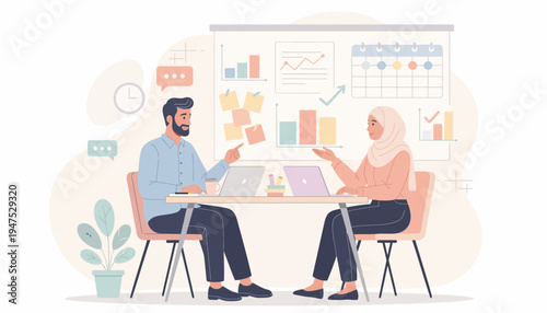 Two business people discussing at table.