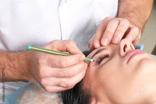 Fotografía plastic surgeon and young woman with correction lines before cosmetic surgery,