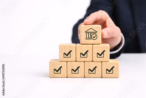 Banking compliance and financial approval concept with wooden blocks check marks and bank verification symbol representing trusted institution isolated on transparent background