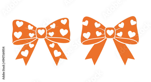Two orange bows adorned with white hearts create a charming decorative image a delightful silhouette
