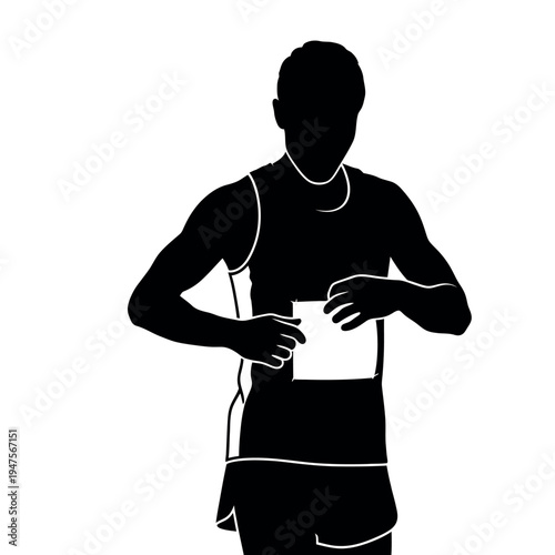 Silhouette of male runner attaching race bib to his singlet.