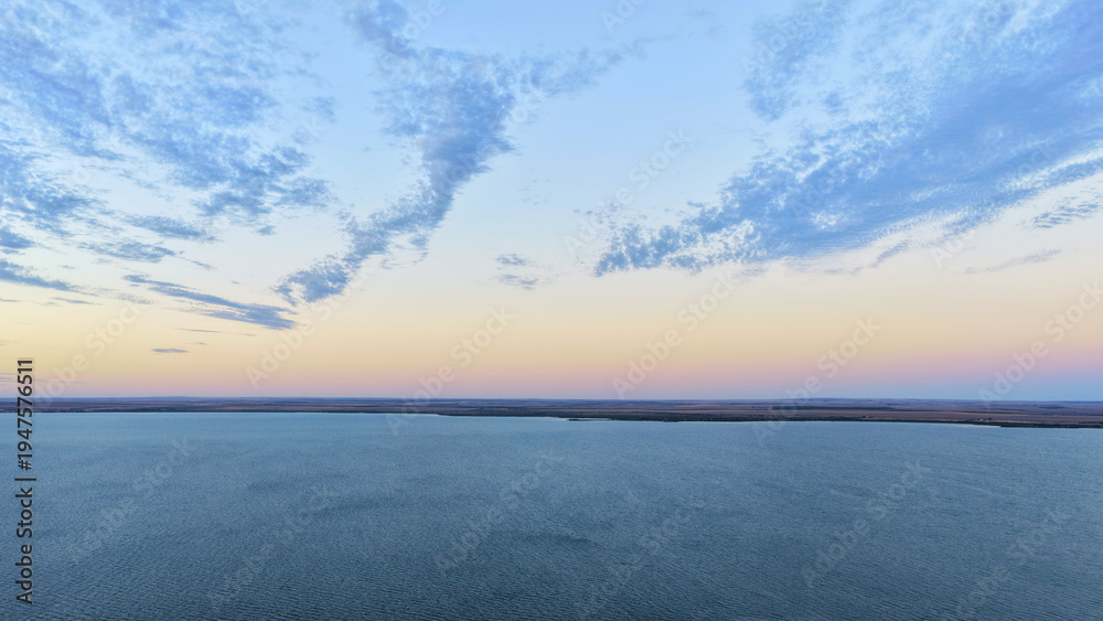 Obraz premium Ceduna and Thevenard, South Australia: 4K aerial drone view of Flinders Ports Thevenard, ocean, beach and Spencer Gulf at golden sunset time