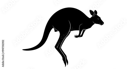 Black silhouette of a kangaroo jumping.