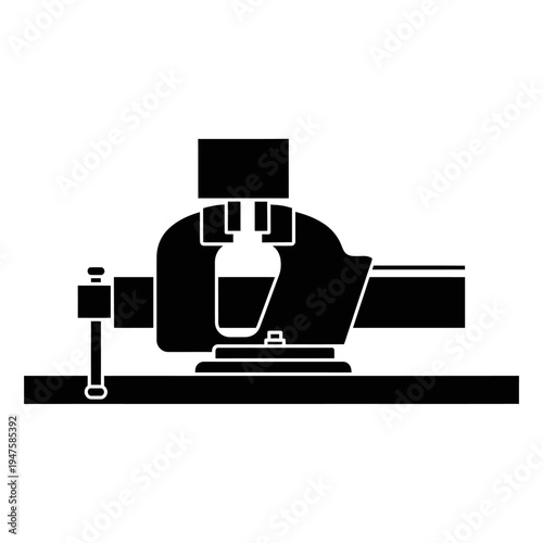 Simple black and white illustration of a metal lathe machine tool