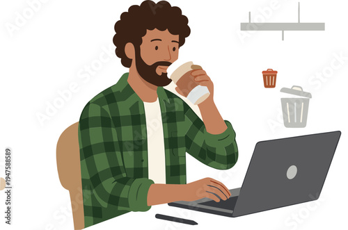 Man working on laptop while drinking coffee at office desk with trash can nearby