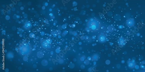 Abstract blue background with blurred bokeh lights and a sparkling dreamy aesthetic