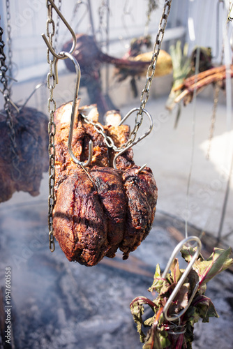 Hanging meat and vegetables over an open fire, the Australian bush cooking style. 