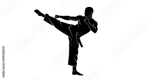 Young man practicing karate kick move.