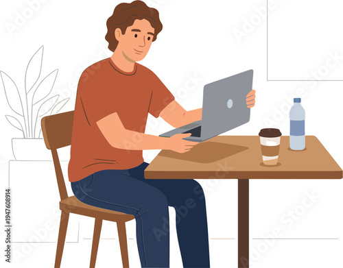 A man sits at a table working on his laptop with a cup and water bottle nearby indoors.