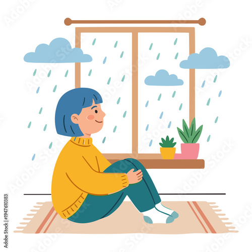 A woman sits on a rug indoors looking out the window at rain.