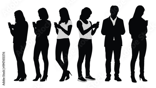 A group of people standing and using their phones