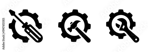 Set of three black icons representing industry and repair: a screwdriver, hammer, and wrench crossed with gears. Isolated on transparent background.