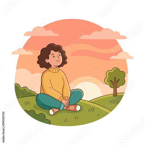 Woman sits cross-legged on green hill meditating at serene sunset
