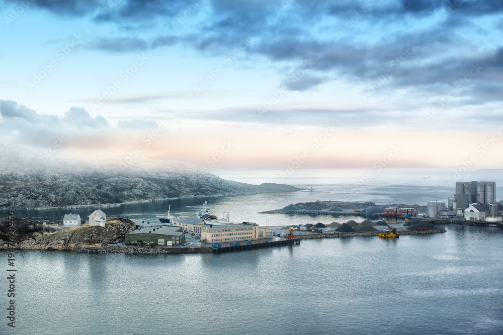 Obraz premium Landscape, ocean and dock with buildings for shipping, global trade and industrial maritime. Sky, seascape and harbor port for freight logistics, cargo ships and export industry for boat distribution