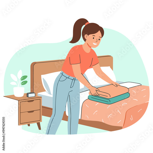 Woman making bed with folded clothes on a nightstand beside her
