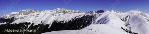 snow covered mountains, panoramic photo with Bucegi Mountains from Bucsa Peak, Romania 
