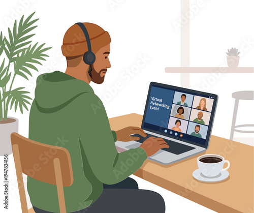 Man working on laptop with video conference call at home office desk