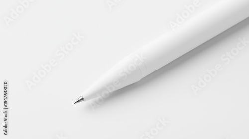 Sleek white ballpoint pen on minimalist white background