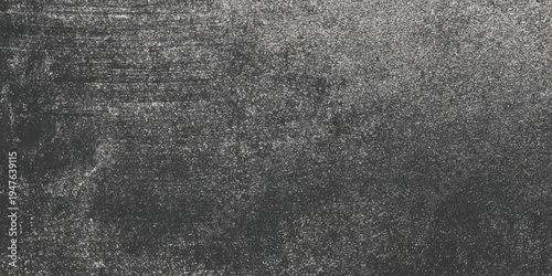Abstract dark grey concrete texture background with distressed cement surface and moody vignette around the edges, highlighting the gritty details, and industrial speckles.