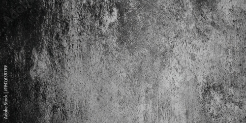 Abstract dark grey concrete texture background with distressed cement surface and moody vignette around the edges, highlighting the gritty details, and industrial speckles.