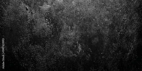 dark moody black stone texture background with weathered grunge surface features a weathered, gritty aesthetic resembling aged stone.